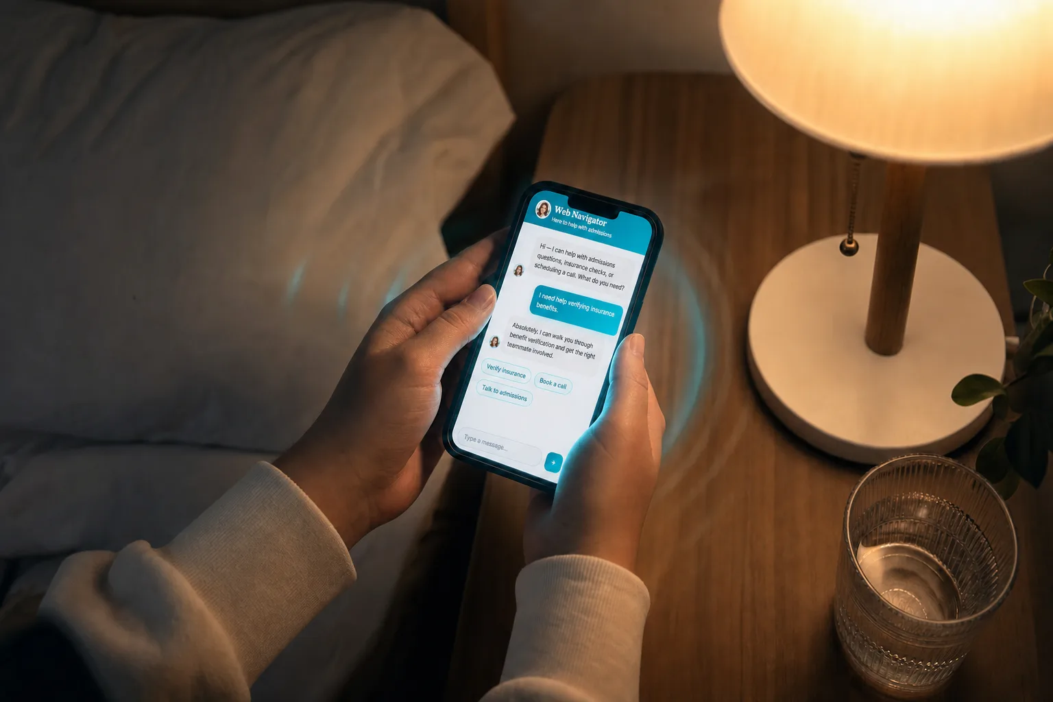 Hands holding a phone showing the Web Navigator chat at night